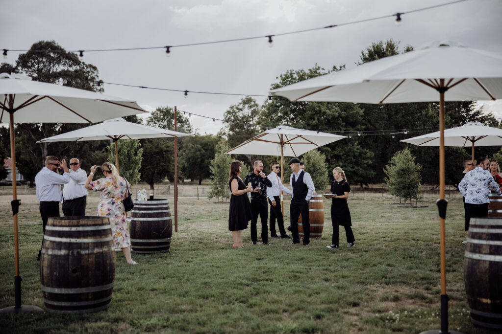 Guests in the outdoor space at The Hayshed photographed by Meredith Photography
