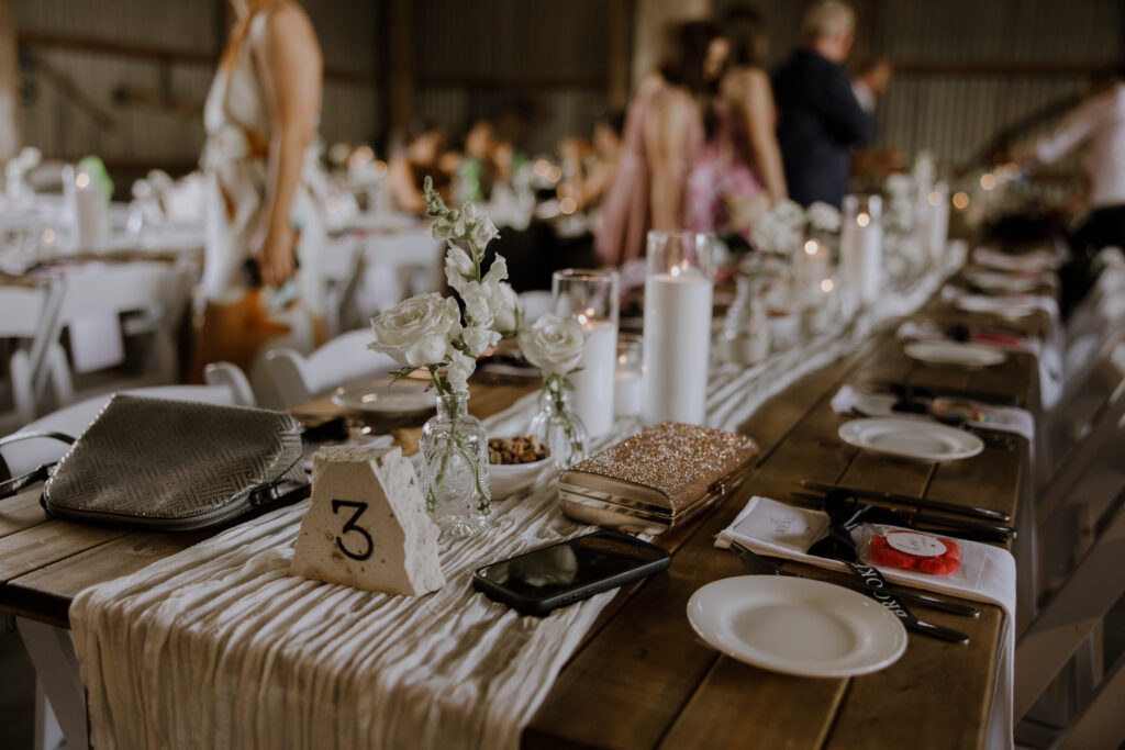 Table decor at The Hayshed at a wedding shot by Meredith Photography